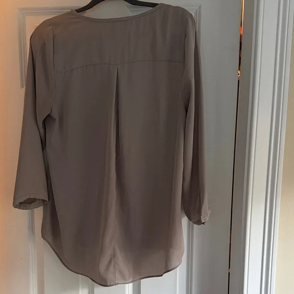 Taupe V-Neck 3/4 sleeve blouse with beaded neckline. - Picture 2 of 2